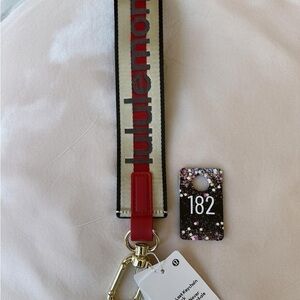 182,NWT Lululemon athletica Never Lost keychain “Worldmark” Red and Cream